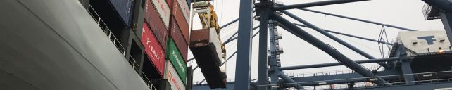 Container being loaded on to ship
